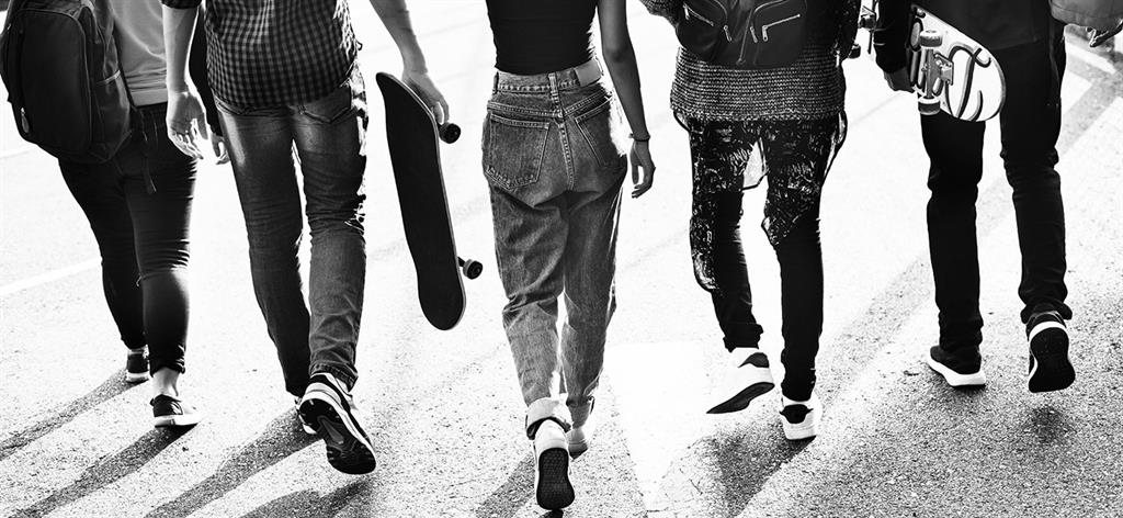 group of teenagers walking in a row